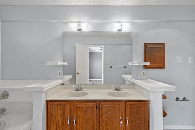 bathroom featuring a bathing tub and vanity