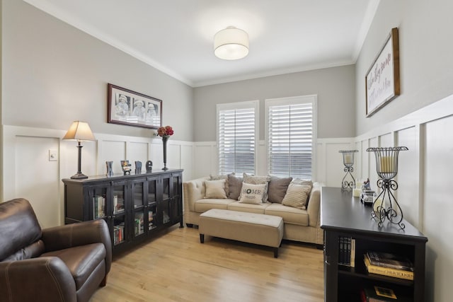 living room with crown molding and light wood-type flooring