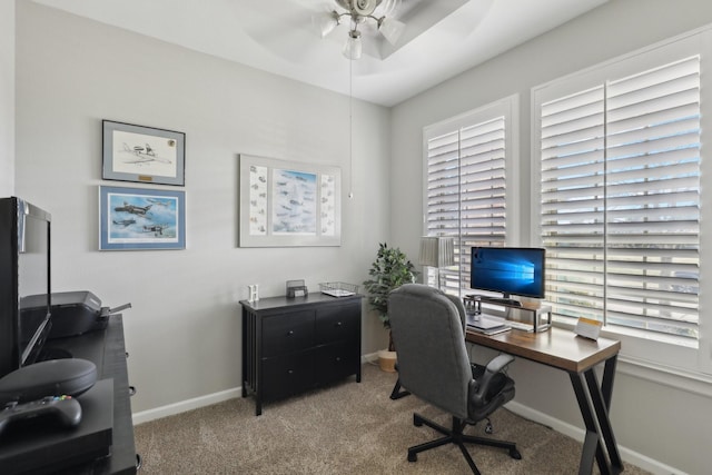 office with ceiling fan, a healthy amount of sunlight, and light carpet