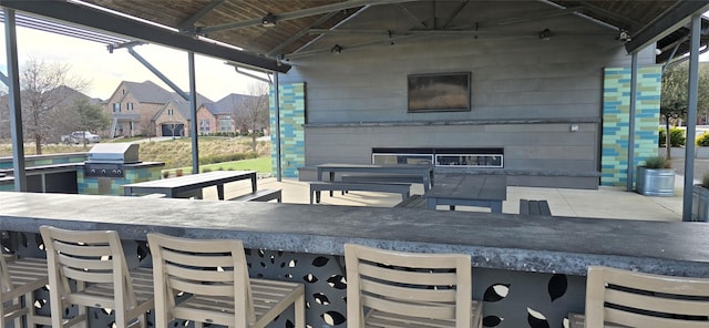 view of patio / terrace with a bar and grilling area