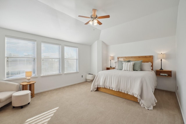 carpeted bedroom featuring lofted ceiling and ceiling fan