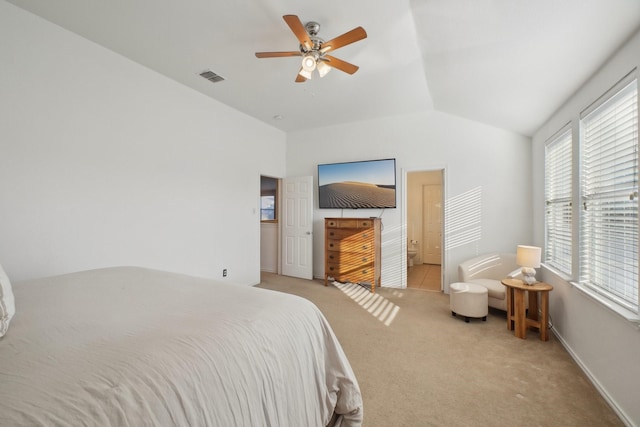 bedroom featuring lofted ceiling, light colored carpet, and ceiling fan