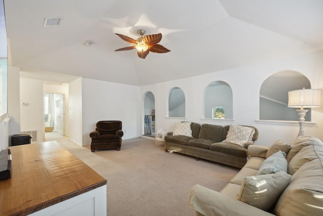 carpeted living room with vaulted ceiling and ceiling fan