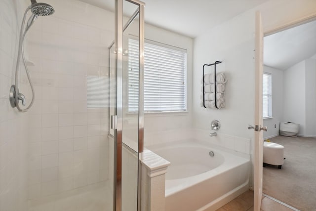 bathroom with tile patterned flooring and plus walk in shower