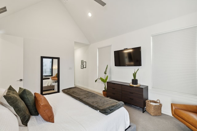 carpeted bedroom featuring ceiling fan and high vaulted ceiling