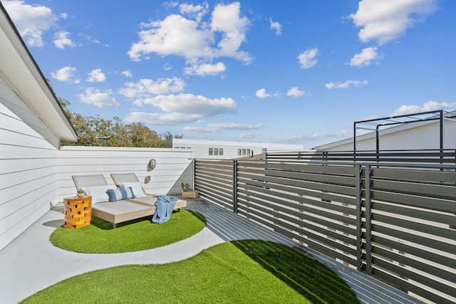 view of yard featuring a balcony