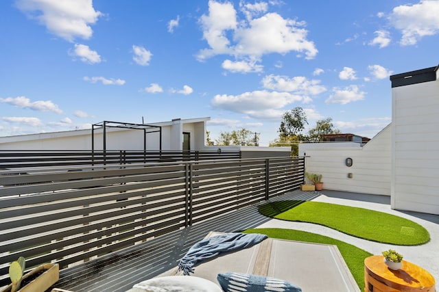 view of yard featuring a balcony