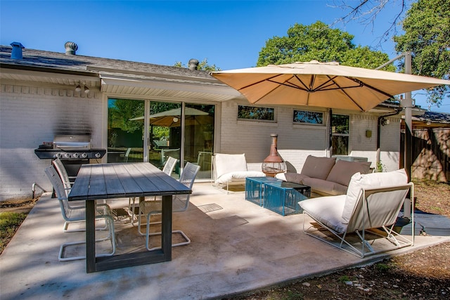 view of patio / terrace with an outdoor living space and grilling area