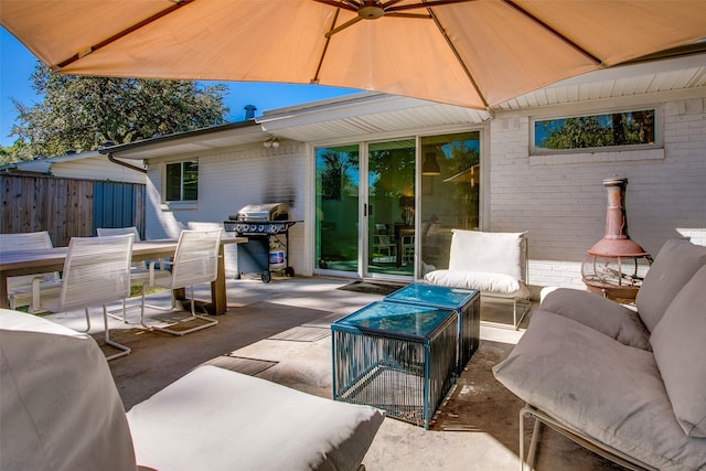 view of patio featuring an outdoor living space and a grill