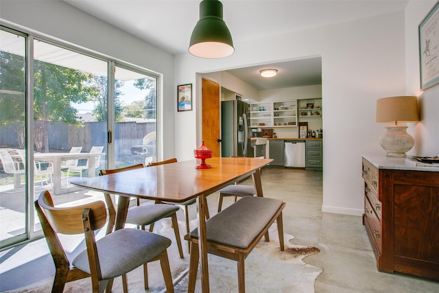 dining space featuring built in shelves