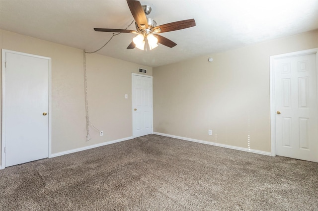 empty room featuring ceiling fan and carpet flooring