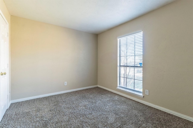 empty room with carpet flooring