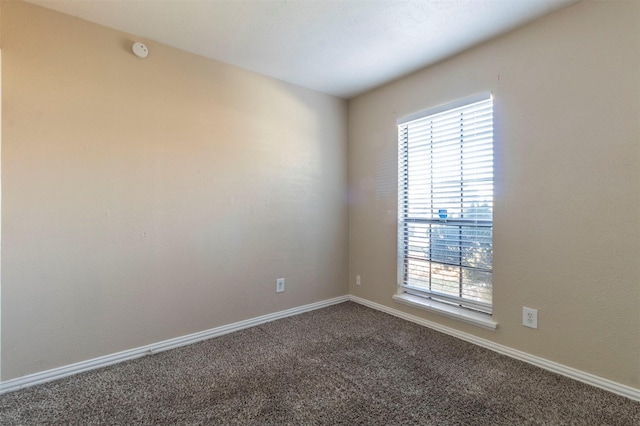 unfurnished room featuring carpet flooring