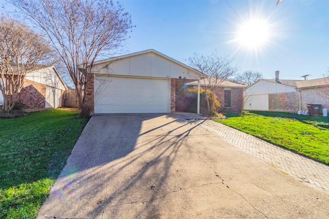 single story home featuring a garage and a front lawn