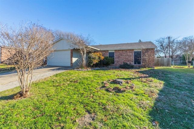 single story home featuring a garage and a front lawn