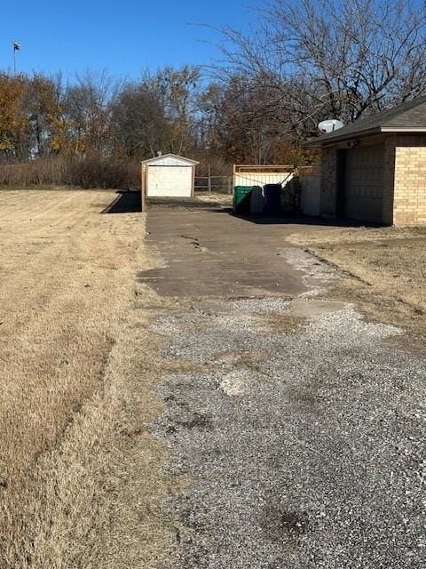 view of yard with an outbuilding and a garage