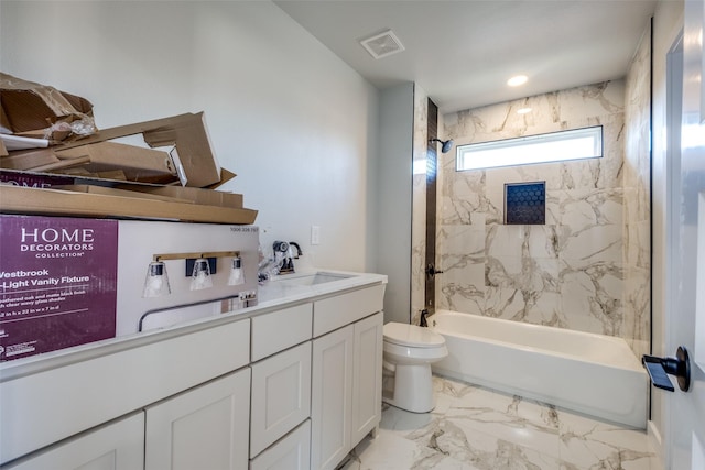 full bathroom with vanity, toilet, and tiled shower / bath