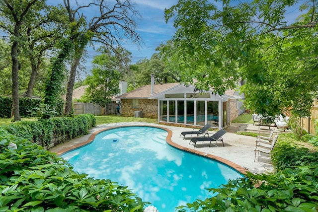 view of swimming pool featuring a patio area and central AC