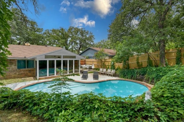 view of pool featuring an outdoor living space and a patio