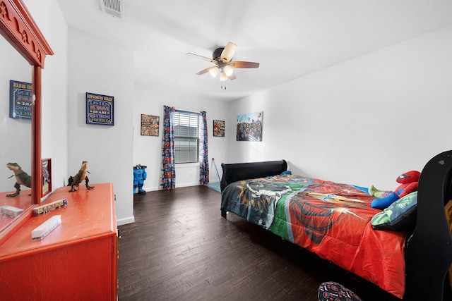 bedroom featuring ceiling fan and dark hardwood / wood-style flooring