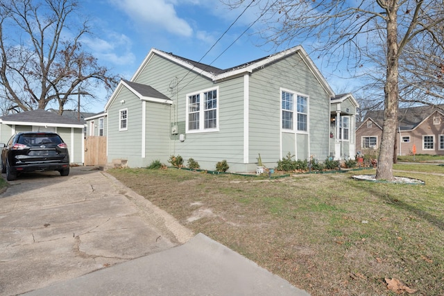 view of home's exterior featuring a lawn and a garage