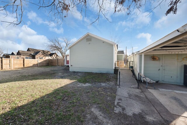 view of side of property with a yard