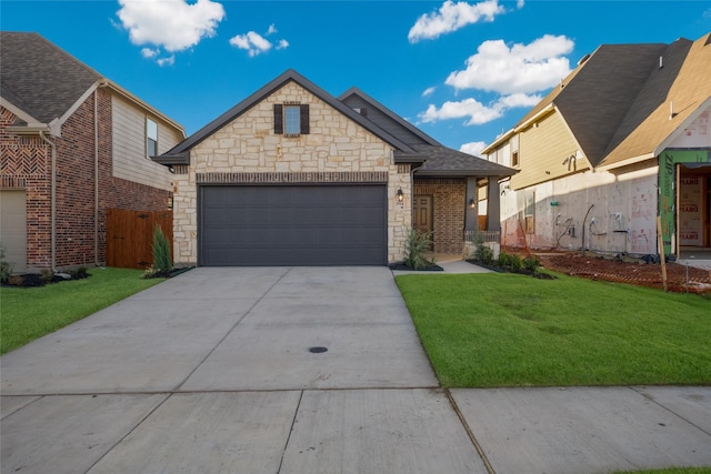 view of front facade with a front yard and a garage