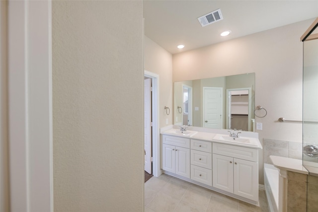 bathroom featuring vanity and tile patterned flooring