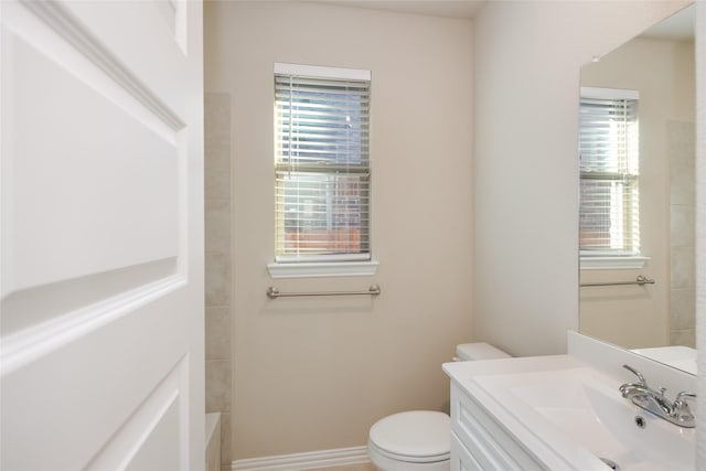 bathroom with vanity and toilet