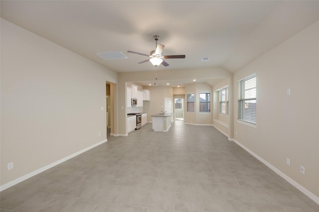 unfurnished living room featuring ceiling fan