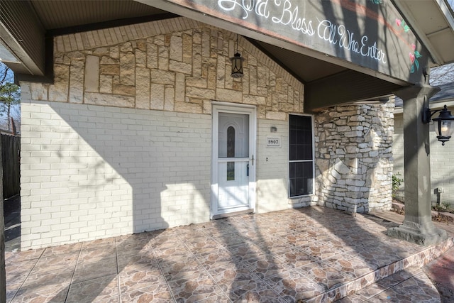 property entrance with a patio area