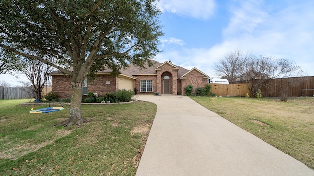 single story home featuring a front lawn and a garage