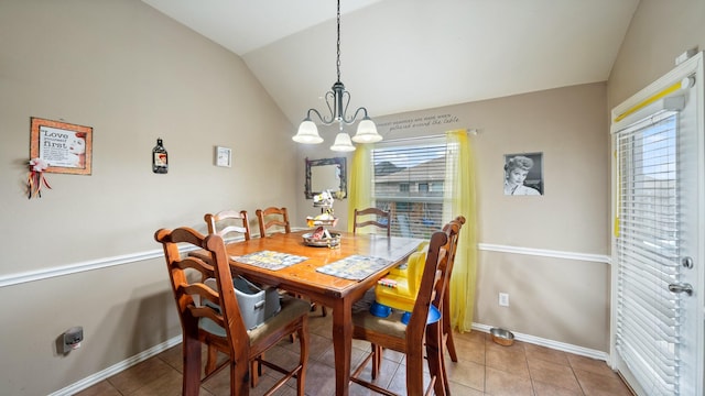 dining room featuring an inviting chandelier, lofted ceiling, and light tile patterned flooring