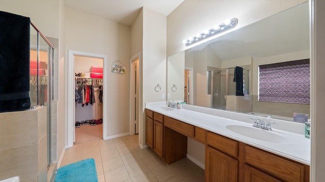 bathroom with vanity, tile patterned floors, and a shower with shower door