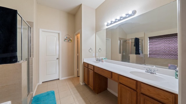 bathroom with tile patterned flooring, vanity, and a shower with shower door