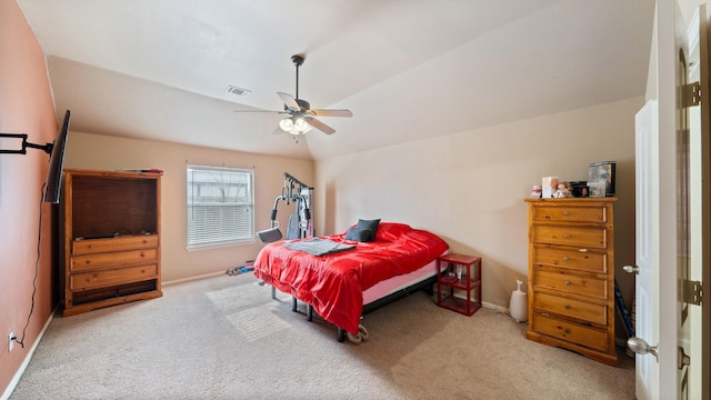 carpeted bedroom featuring vaulted ceiling and ceiling fan