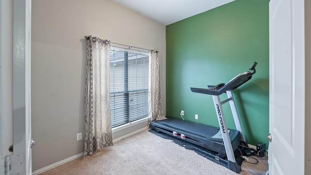 workout area featuring carpet and plenty of natural light