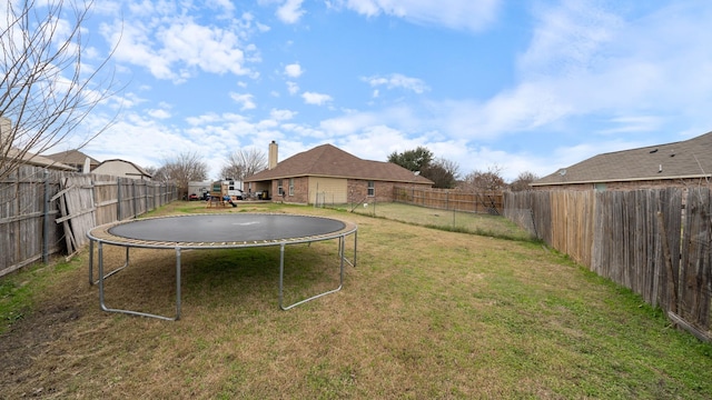 view of yard featuring a trampoline