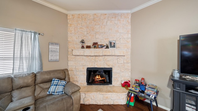 living room featuring a stone fireplace, dark hardwood / wood-style flooring, and ornamental molding