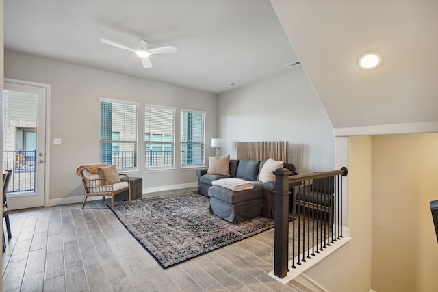 sitting room featuring ceiling fan, light hardwood / wood-style floors, and a healthy amount of sunlight