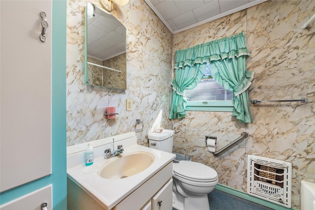 bathroom with walk in shower, heating unit, crown molding, toilet, and vanity