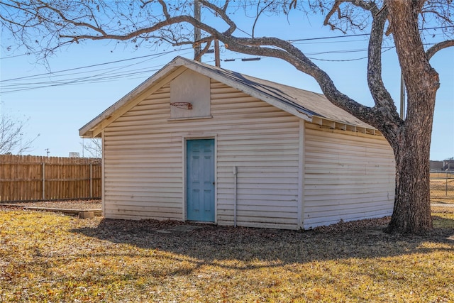 view of outbuilding featuring a lawn