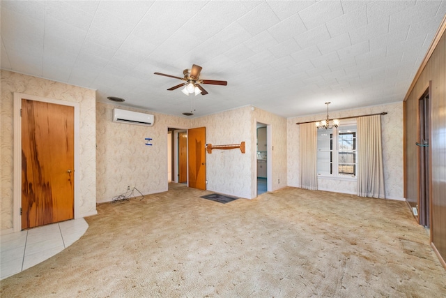 unfurnished living room with a wall mounted air conditioner, ceiling fan with notable chandelier, and light carpet