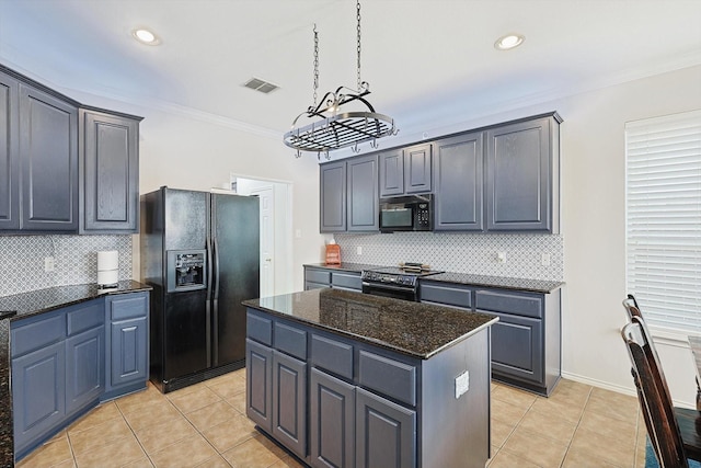 kitchen with visible vents, a kitchen island, crown molding, light tile patterned flooring, and black appliances