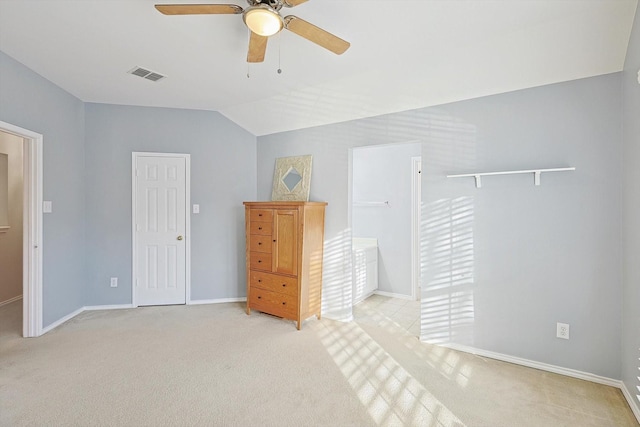 bedroom featuring visible vents, carpet flooring, baseboards, ceiling fan, and vaulted ceiling