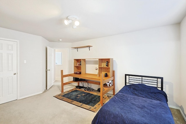 carpeted bedroom with baseboards