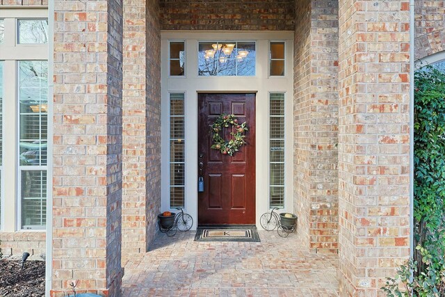 foyer entrance featuring light wood-type flooring and ornamental molding