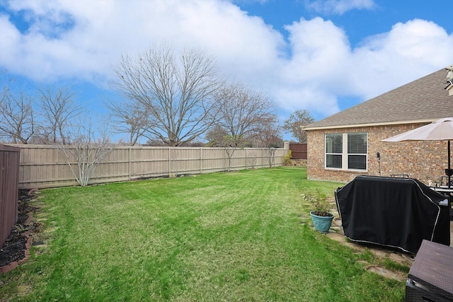 view of yard with a fenced backyard