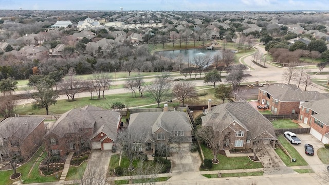 aerial view featuring a residential view and a water view