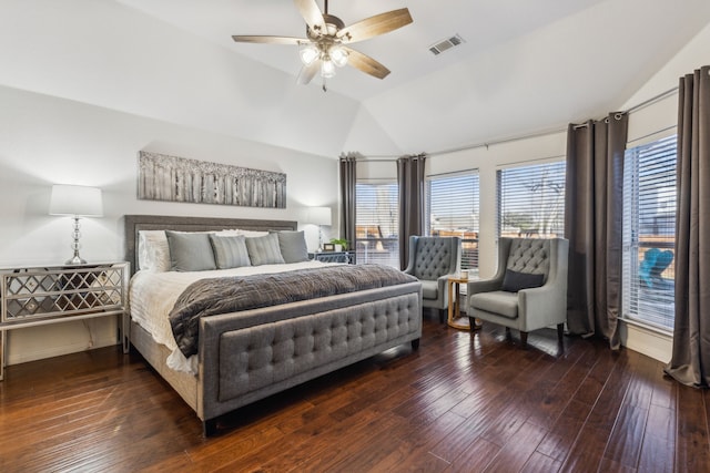 bedroom featuring ceiling fan, dark hardwood / wood-style floors, and lofted ceiling